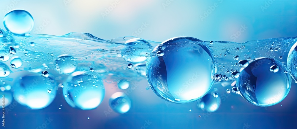 Poster blue bubbles gracefully floating in a beautiful abstract background with copy space image