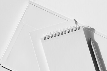 Monochrome Business Office Desk Flatlay. Notebook, Cards, Spiral Notebook with Blank Sheets, Pencil.