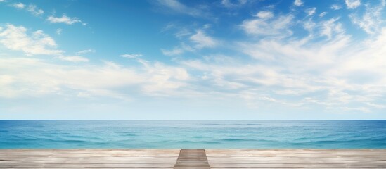 Pier stretching into the vast ocean with a serene horizon ideal for a copy space image