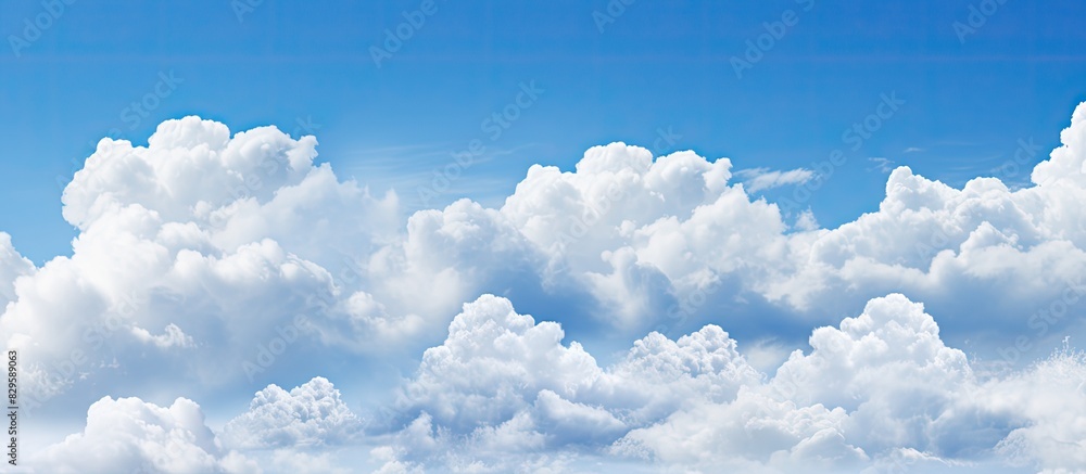 Poster clouds arranged in picture perfect alignment against a clear blue sky creating an ideal backdrop for
