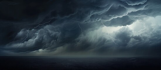 Dark storm clouds fill the sky creating a dramatic scene suitable for a copy space image