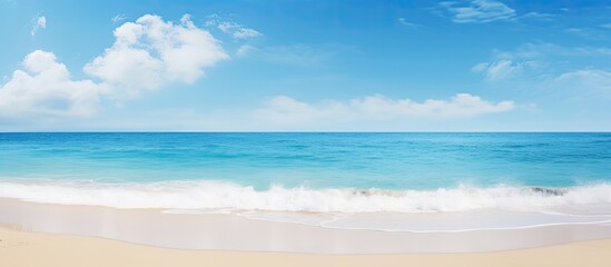 Obraz premium A serene beach scene with a tranquil ocean under a clear sunny sky ideal for a copy space image