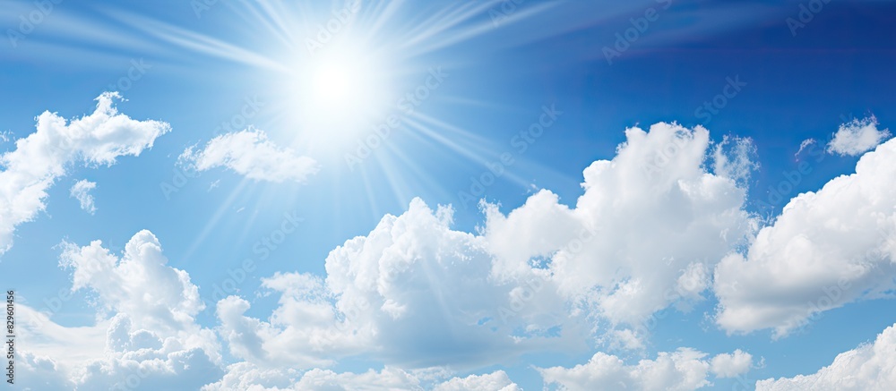 Poster a serene scene of a sunny sky with a high sun position and some sparse clouds ideal for a copy space