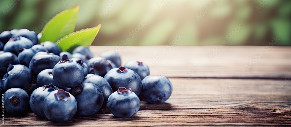 Aufkleber close up of fresh blueberries scattered on a wooden table with selective focus creating a natural an