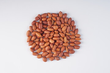 raw peanuts on a white background with studio lighting