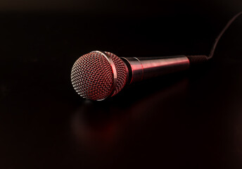 microphone on a black background with red backlight
