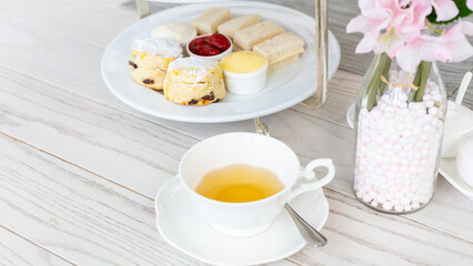 Afternoon tea stand with sweet treats, Afternoon tea set with dessert, High tea set with dessert.