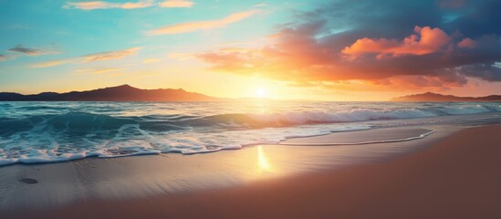 Sunset casting a serene glow over a tranquil beach scene with half of the sandy shore visible creating a peaceful ambiance with copy space image