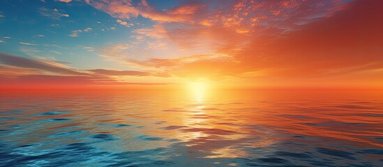 In the evening a picturesque sunset at sea with the sun setting over the horizon creating a beautiful scene for a copy space image