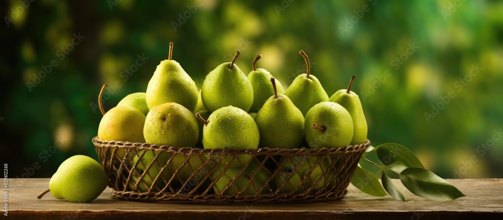 Poster a fresh ripe green packham pear displayed in an iron basket on a table with copy space image pears f