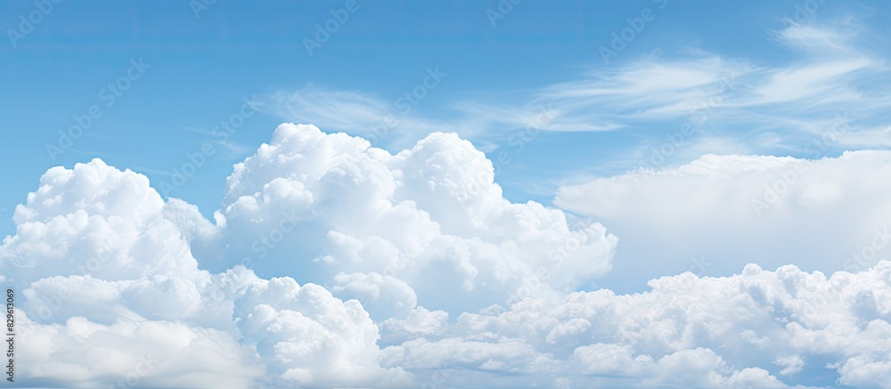 Poster background with a pattern of white clouds against a sky creating a picturesque copy space image