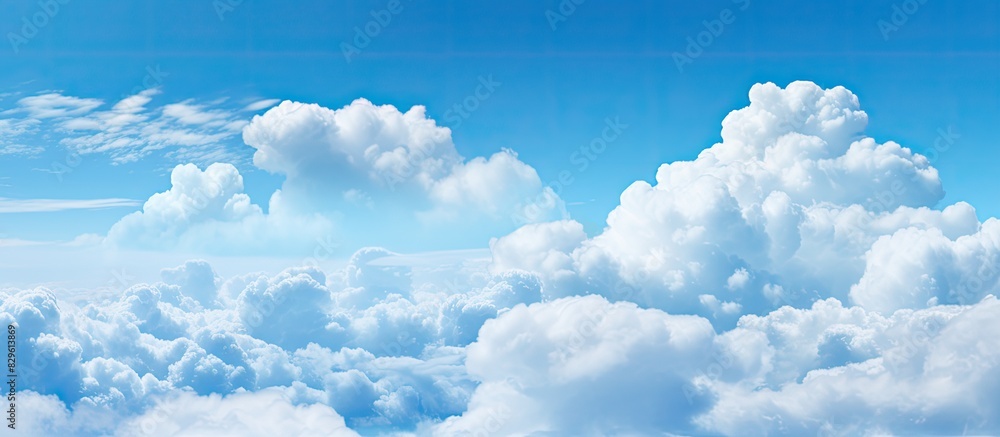 Poster clouds floating in a blue sky creating a serene atmosphere with a copy space image
