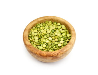 Green split peas in a wooden bowl isolated on white background.