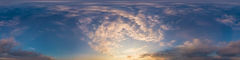 Bright sunset sky panorama with glowing red pink Cumulus clouds. HDR 360 seamless spherical panorama. Sky dome or zenith in 3D, sky replacement for aerial drone panoramas. Climate and weather change.