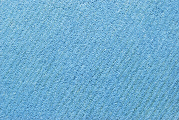 A sheet of porous, fibrous, and ribbed texture as background