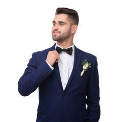 Handsome young groom with boutonniere on white background. Wedding accessory