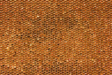 Golden overlap sequins fabric texture close up as background