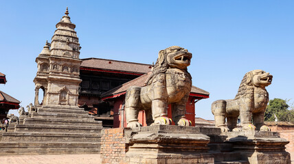 View of Twin Stone Lions And Siddhi Vatsala Temple, Bhaktapur Durbar Square, Kathmandu, Nepal.