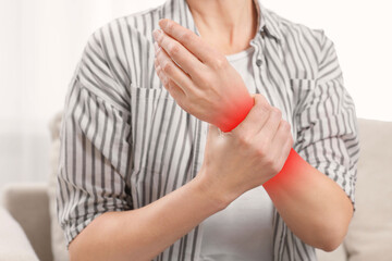 Obraz premium Woman suffering from pain in hand indoors, closeup