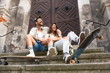 Couple goals. Simple living. Freedom as lifestyle. Young couple enjoying outdoor and sunset. Having fun on nice weather. Man and woman, hipsters, generation Z with cool attitude.