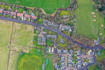 Obraz premium Straight down aerial drone photo of the village of Lightcliffe in Halifax in West Yorkshire in the UK, showing a row of historic victorian residential houses on a cold day in the winter time
