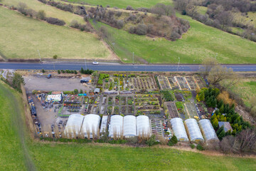 Aerial drone photo of a flower and plant nursery, located in the town of Lightcliffe in Halifax, West Yorkshire in the UK on a cold day in the winter time