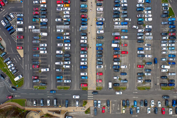 Aerial drone photo of a busy car park in the town of Seacroft in Leeds West Yorkshire in the UK,...