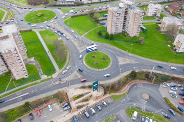 Aerial drone photo of the town of Seacroft in Leeds West Yorkshire UK showing a roundabout and busy...