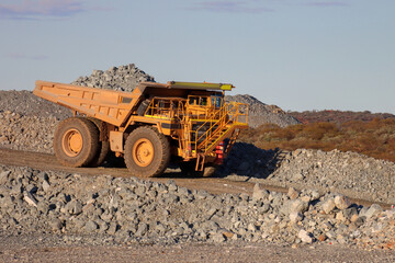 Mining dump, or haul truck with a load of rock at an Australian mine in the Outback