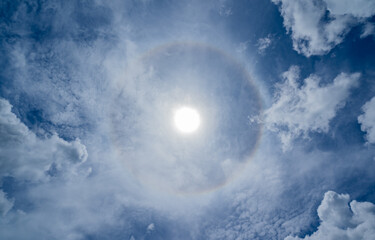 Circumscribed halo Sun halo on a day with many clouds in the sky