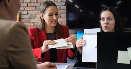 Team of engineers and architects in construction company managing project. Focusing on safety,...