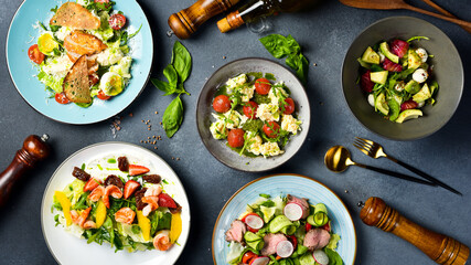 A set of vegetable dishes with seafood, veal and chicken. Top view.