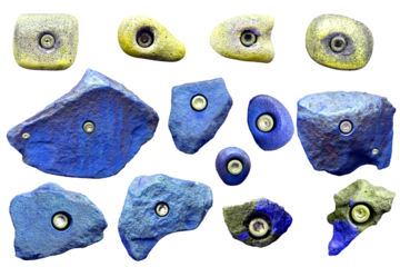 Set of grips different colors and shapes for climbing wall isolated on white background / set collection of various climbing holds with clipping path / bouldering extreme sport	
