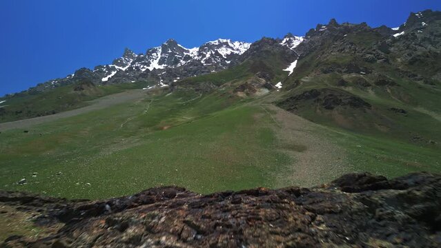 Tibetan mountains with green hills and cliffs