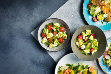 Food. A set of salads from fresh vegetables. Colorful appetizing salads. Top view.