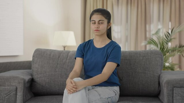 Indian teenage girl looking to the camera