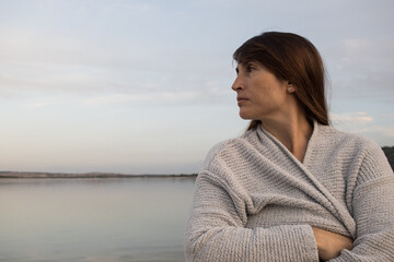 woman looking calm and relaxed towards, horizon alone on the coast. Feeling. emotion concept....