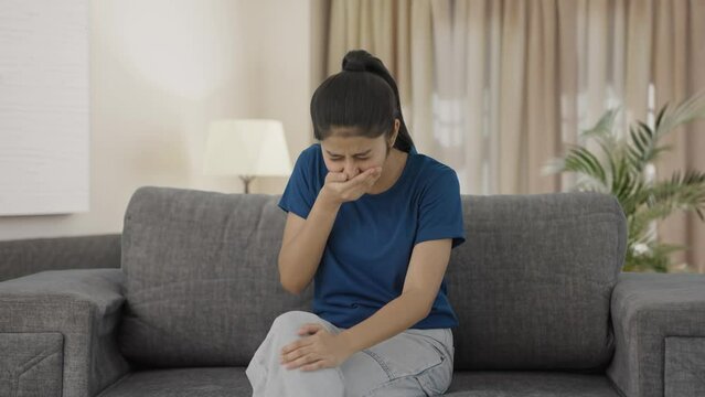 Sick Indian teenage girl having a cold and cough