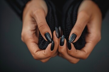 Fototapeta premium Girl's hands with a beautiful art manicure design nails extension procedure in a beauty salon