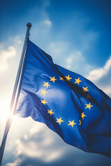 Flag of European Union waving in the breeze against a sunset sky. Banner with EU flag.