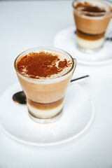 Barraquito - a popular layered coffee drink from Tenerife, featuring espresso, condensed milk, frothed milk, and a touch of Licor 43