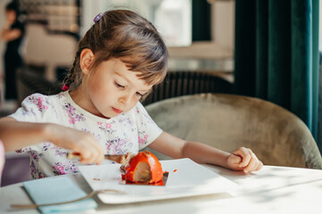 A little girl enjoying a slice of cake, illustrating the simple yet profound joy found in life&rsquo;s little pleasures