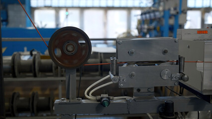Cable production process, mechanism in a cable factory. Creative. Industrial background with...