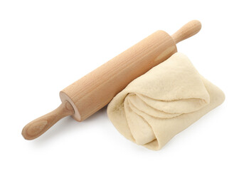 Raw dough and rolling pin isolated on white