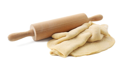 Raw dough and rolling pin isolated on white