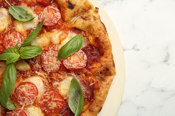 Delicious Margherita pizza on white marble table, top view