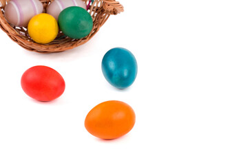 easter eggs in a basket on a white background
