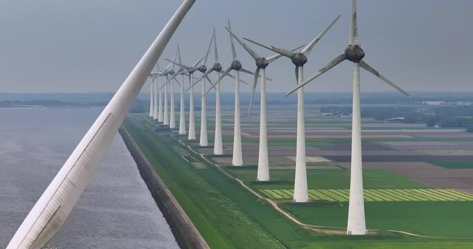 Windmill park green energy from drone view, windmill offshore wind farm in the Netherlands windmill turbines. Windmill farm in the lake the biggest in the Netherlands, sustainable development
