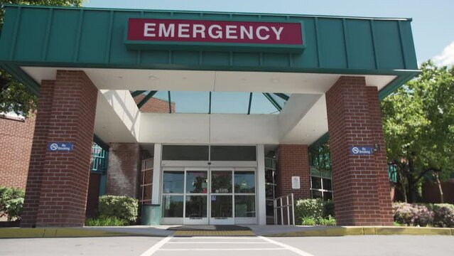 Exterior of Emergency Department on a Sunny Day, Pan Up, 4K