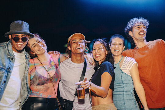 Fun nightlife with friends: Young people enjoying themselves at a musical concert